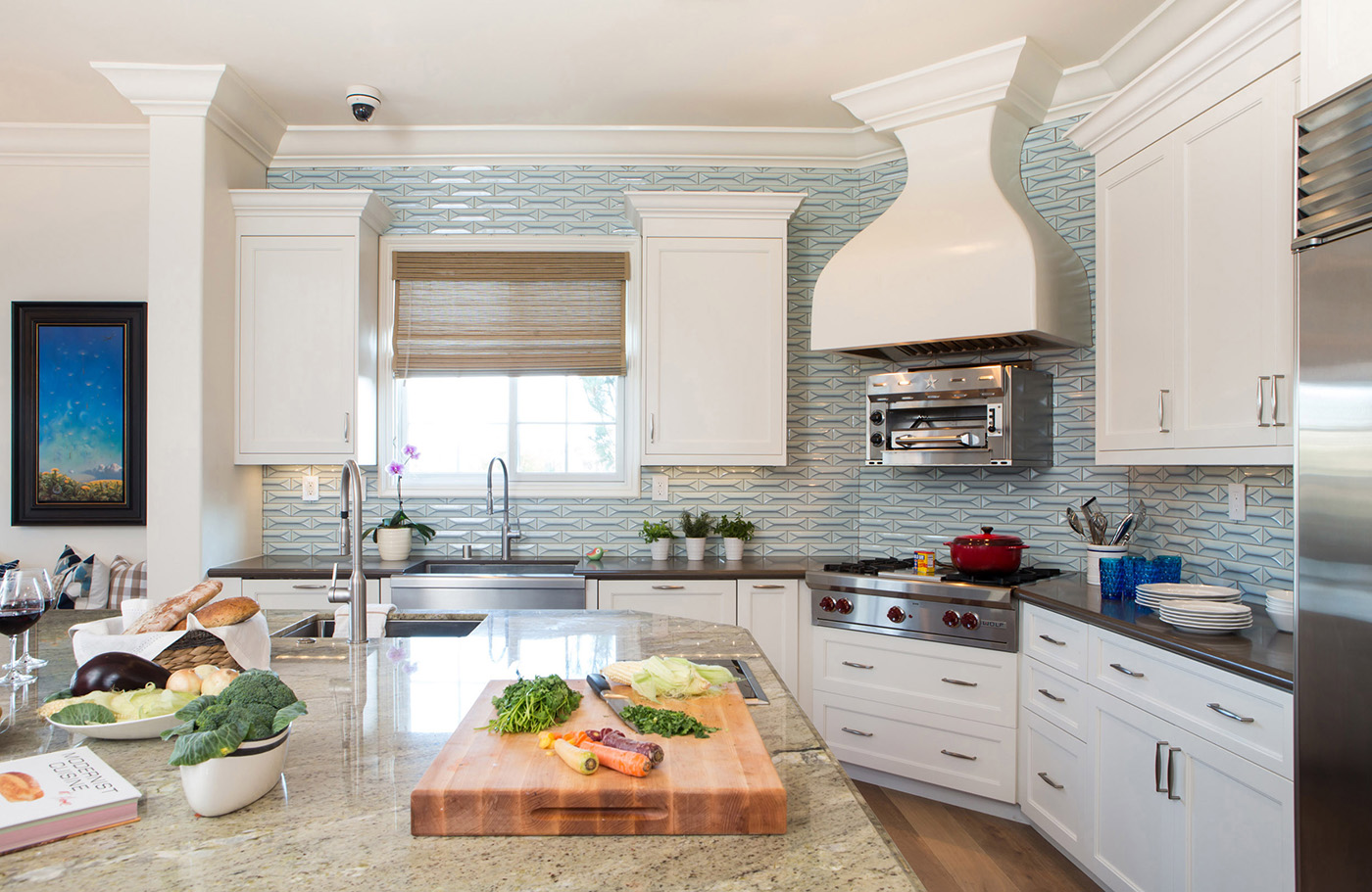 an eco friendly kitchen in los angeles with blue backsplash and pizza oven