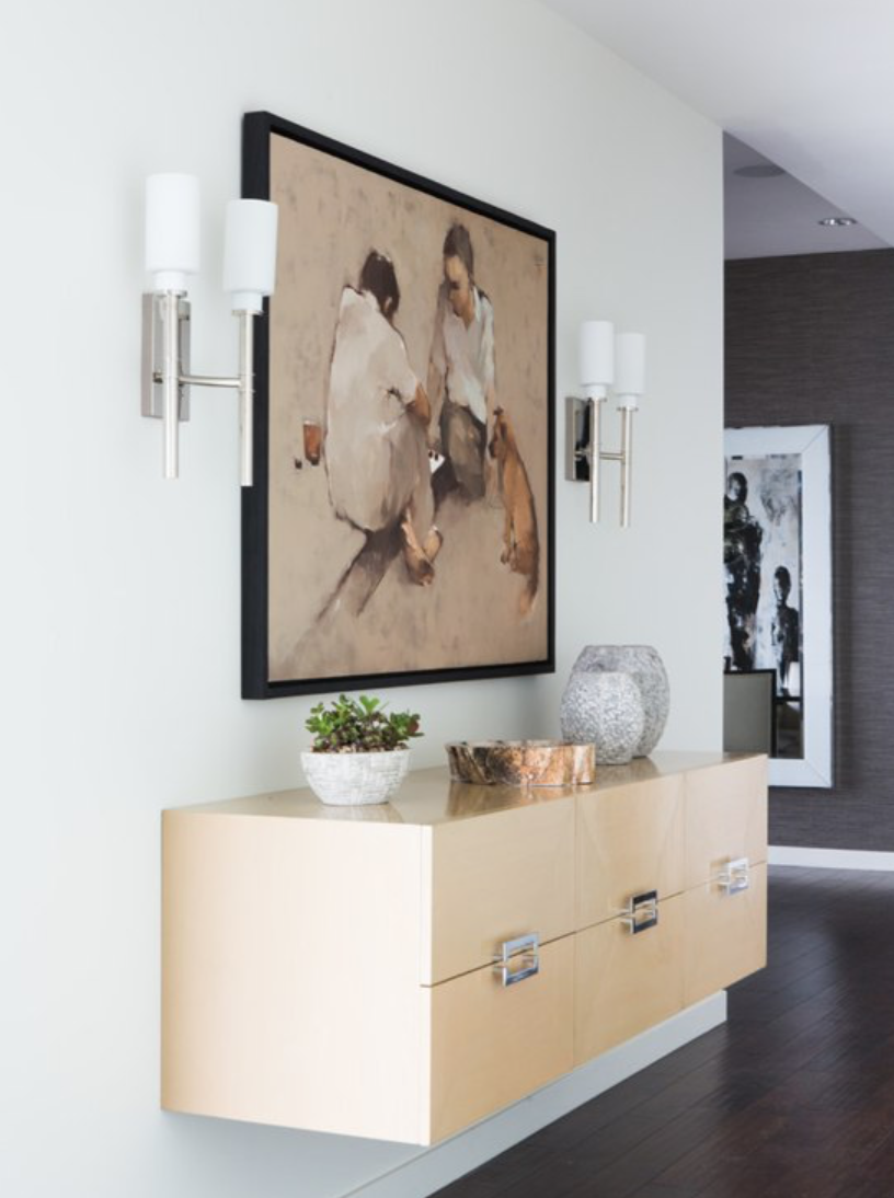 High contrast is incredibly pleasing to the eye. Think opposite colors & mixed metals like we did in this modern coastal entry way.