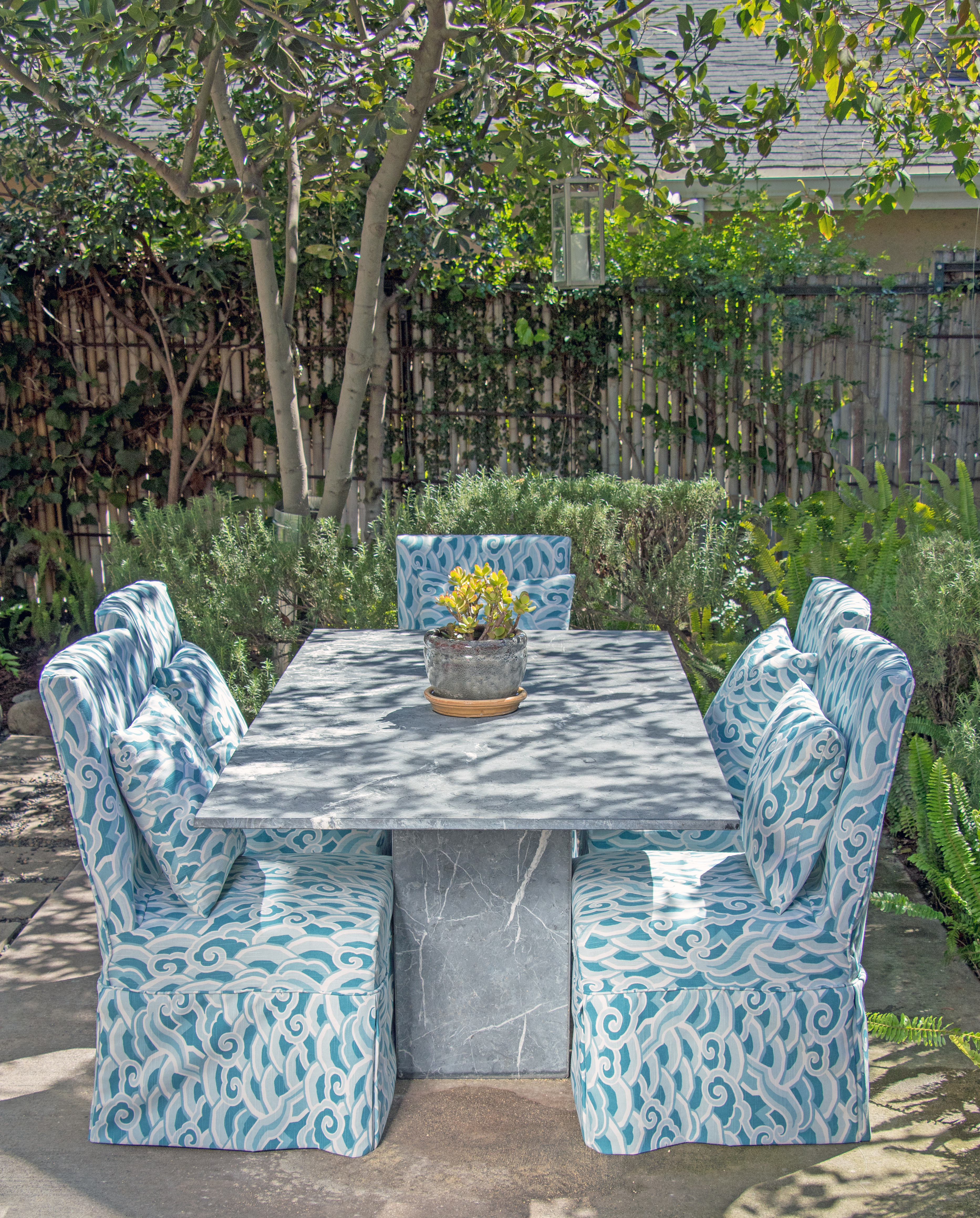 We love experimenting with bringing our indoor chairs outside for a special meal and covering with the impeccably constructed custom dining chair slipcovers from Calico.