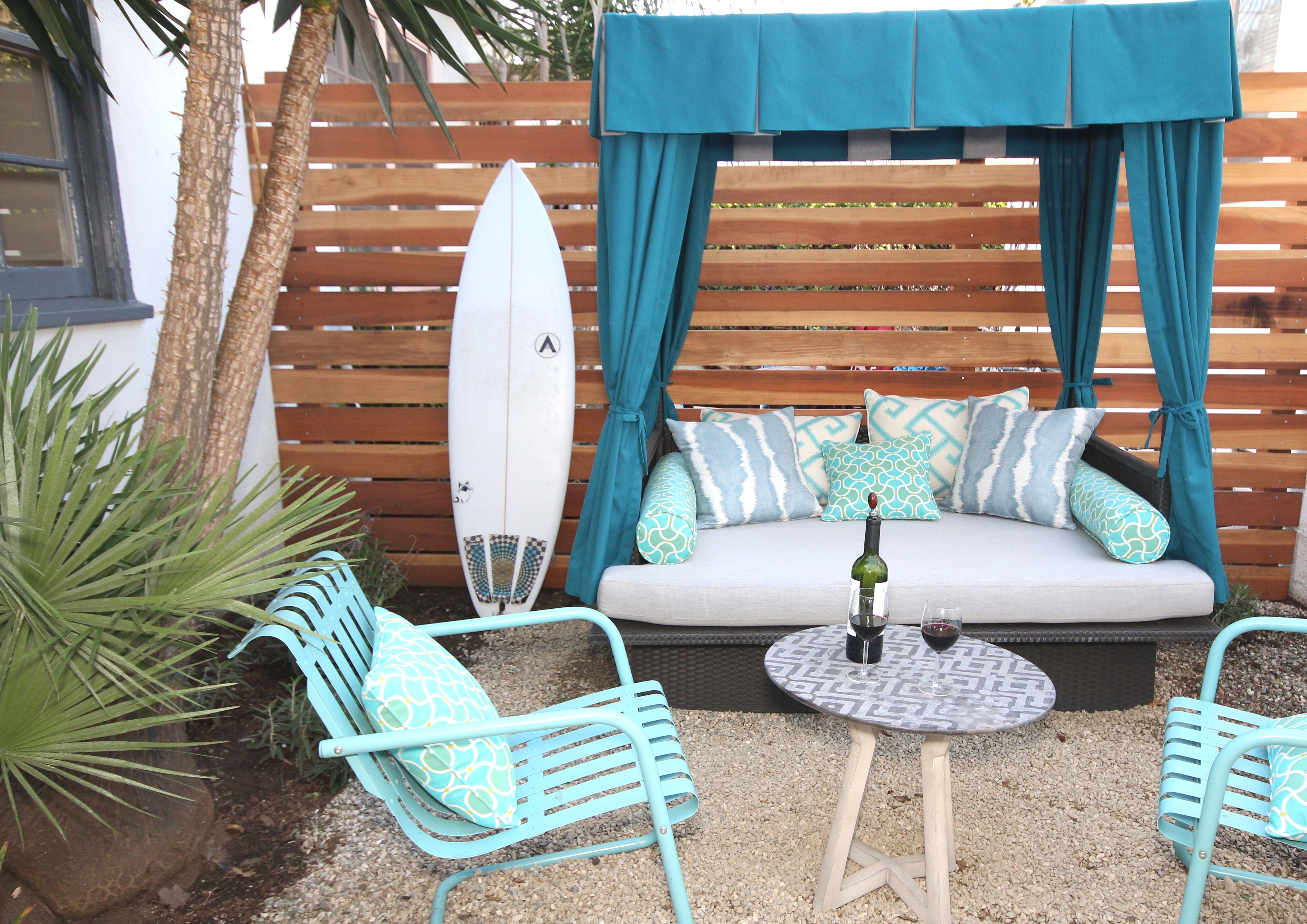 Cabana and outdoor lounge complete with Lamps Plus outdoor chairs and Calico Sunbrella outdoor fabrics