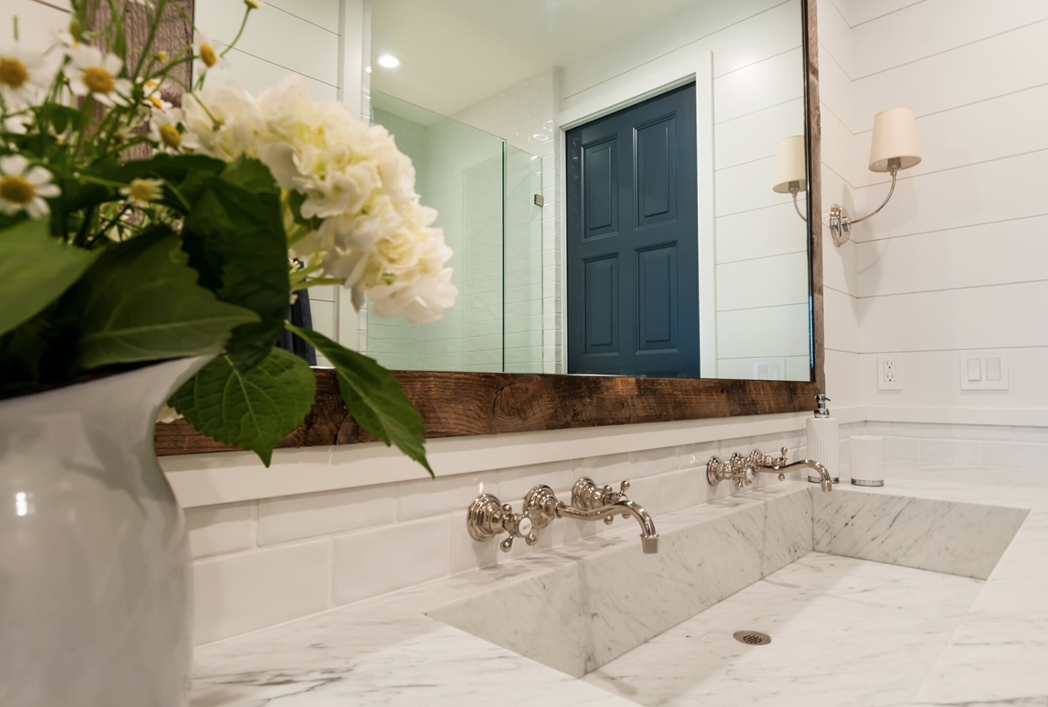One of the tenets of the modern farmhouse design is including some casual, exposed, industrial features. A great way to introduce this style into your coastal farmhouse bathroom is in the form of an oversized vanity mirror.