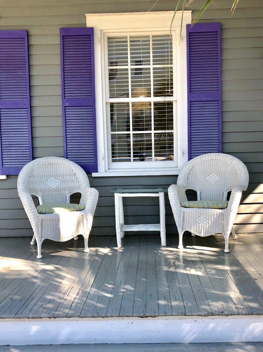 Grey Home with Purple Shutters