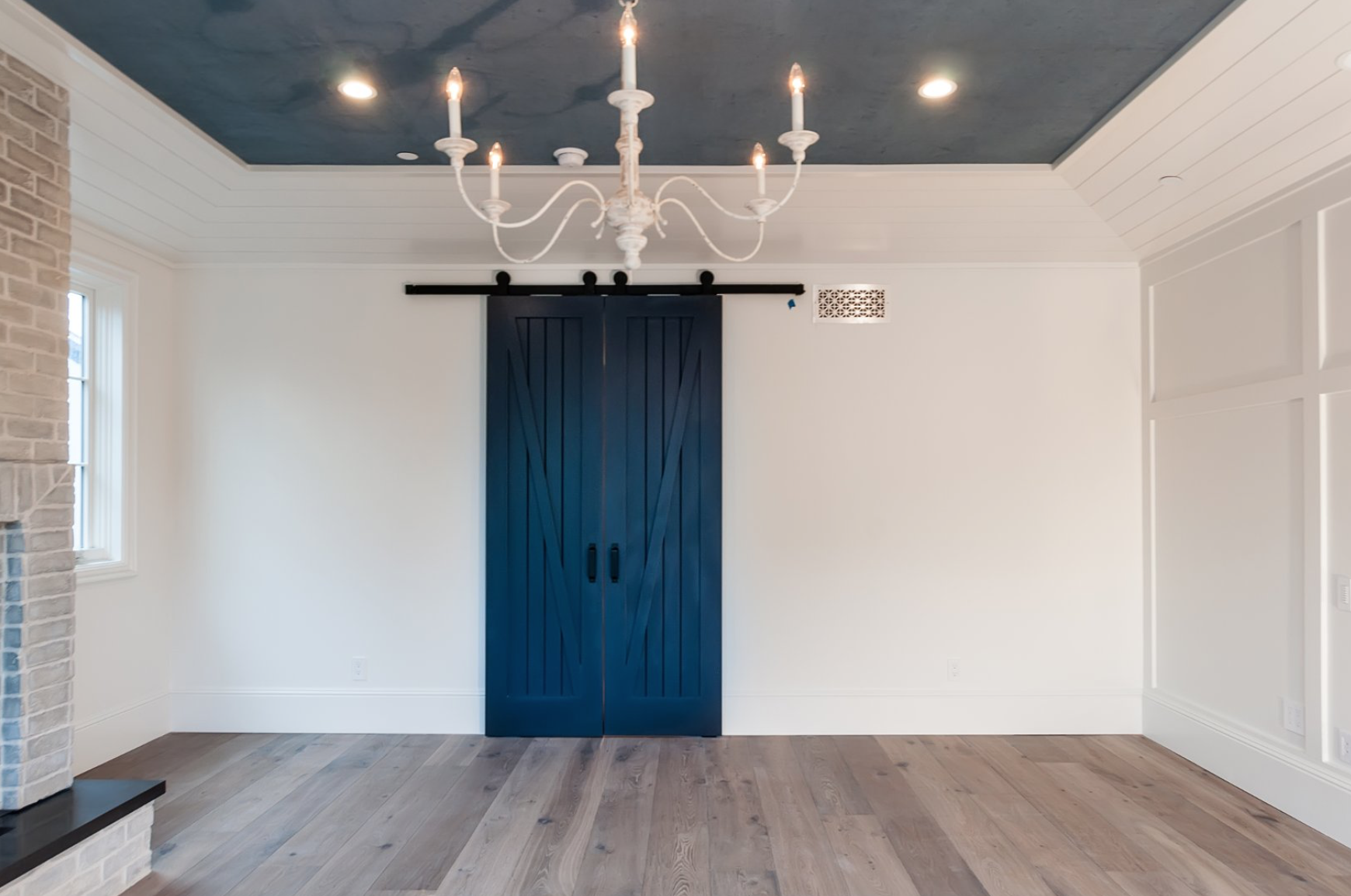 barn doors painted in modern, funky colors as both a design statement and as a way to make a room more flexible, you can section off a smaller room or keep it open.