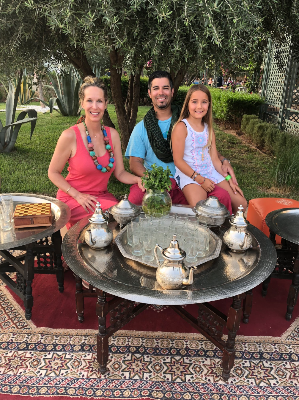 Celebrity Interior Designer Lori Dennis with family dining in Morocco