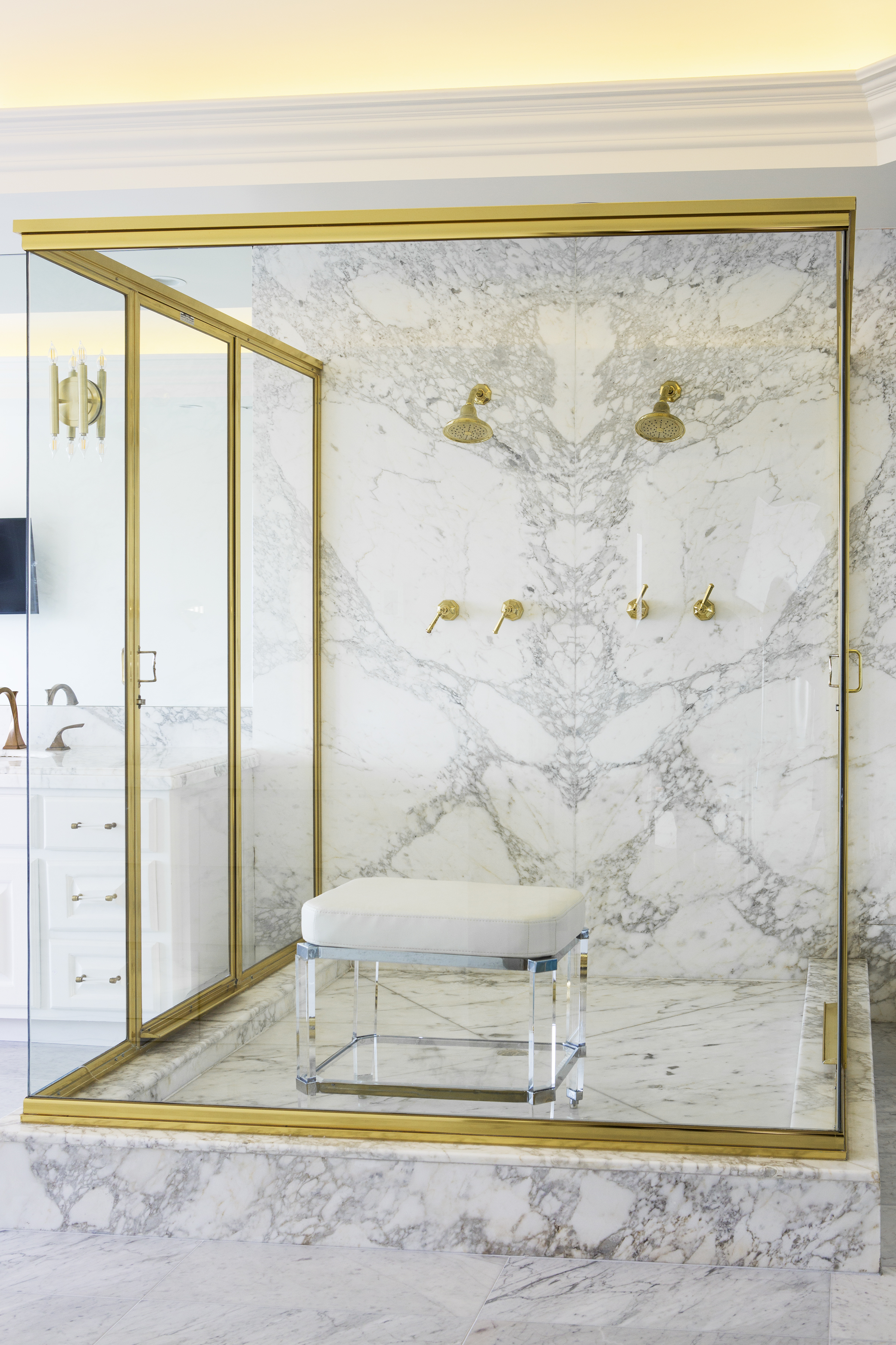The master bathroom is actually one of my favorite rooms of the home.  Because we liked the marble so much and because of the expense of replacing it we decided to leave the master shower in its original configuration and just replace the Faucets.