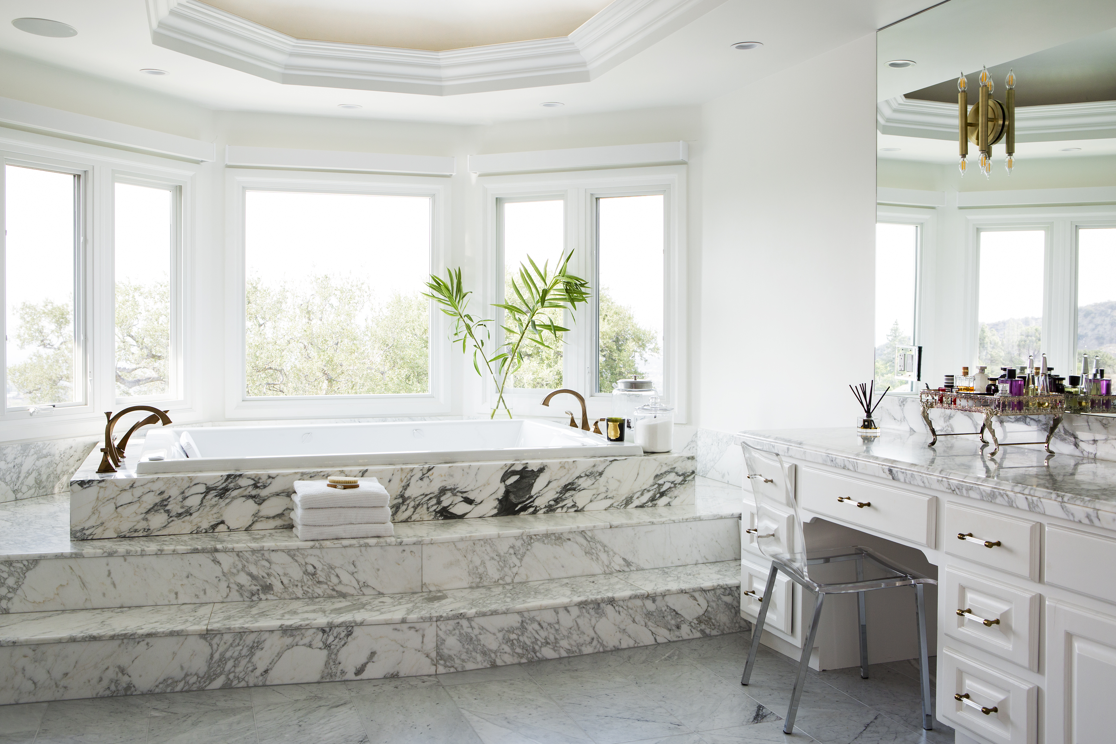 The master bathroom is actually one of my favorite rooms of the home.  Because we liked the marble so much and because of the expense of replacing it we decided to leave the master shower in its original configuration and just replace the Faucets.