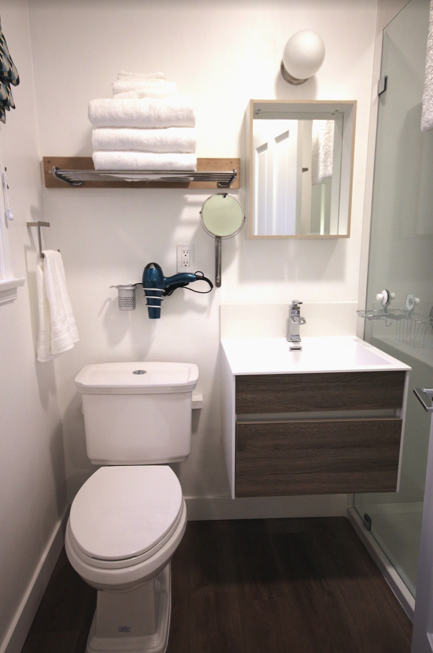 Vacation Rental Renovations: Should They Be Trendy or Timeless? all white modern bathroom in a vacation rental in Los Angeles
